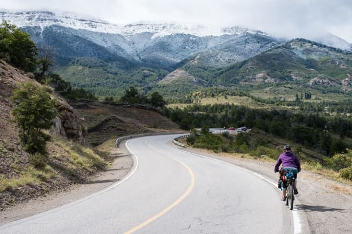 Biking down a road