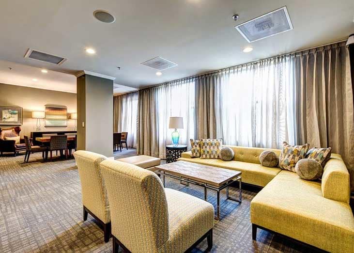 The lounge area will delight you with it's charm and uplifting yellow accents at The Eva