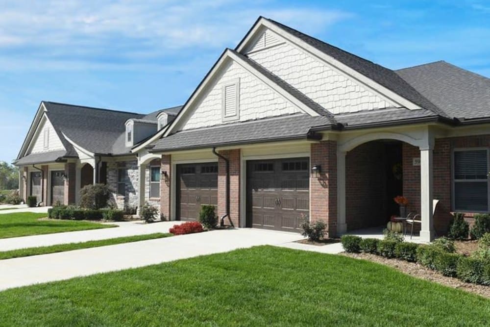 Duplex senior homes with a shared driveway at Blossom Ridge in Oakland Charter Township, Michigan