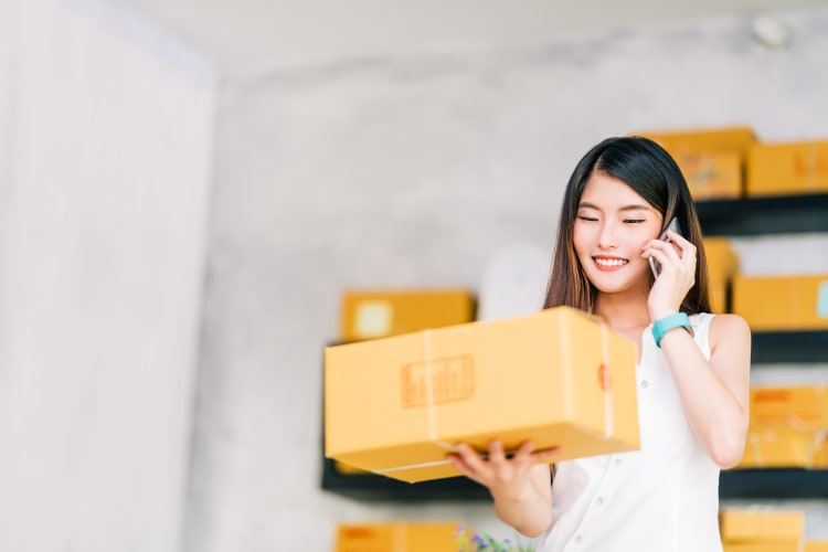 Woman holding a box at Storage Star in Plano, Texas