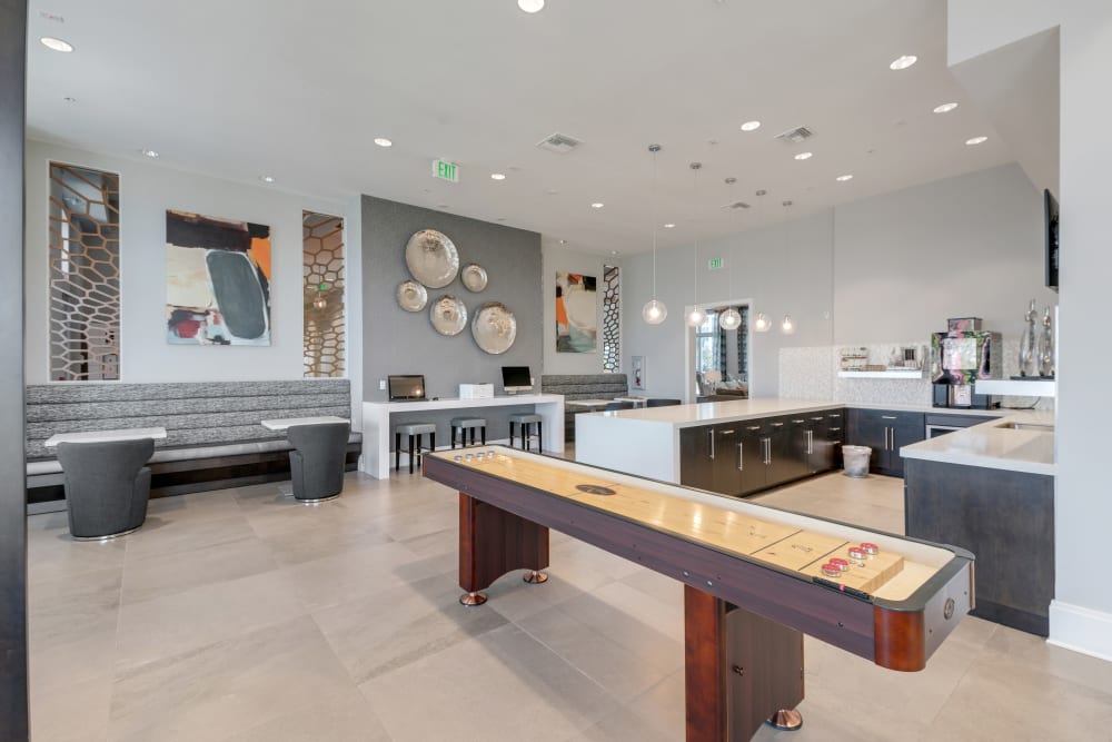 Resident game room and indoor kitchen at Champions Vue Apartments in Davenport, Florida