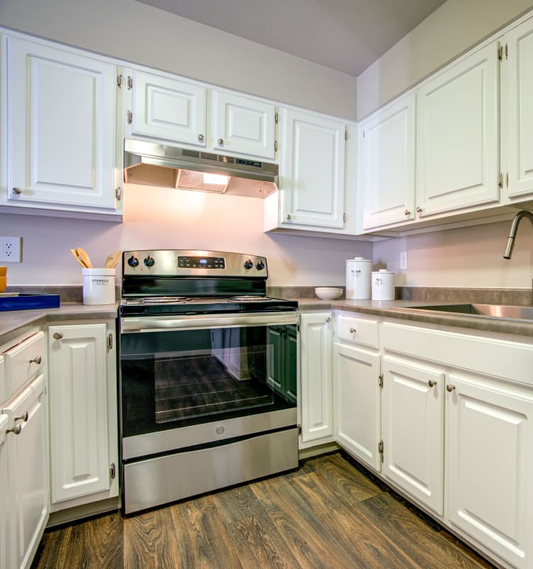 Modern kitchen with granite-style countertops in a model home at Terra Martinez in Martinez, California