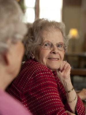 A resident smiling at The Pointe at Summit Hills in Bakersfield, California