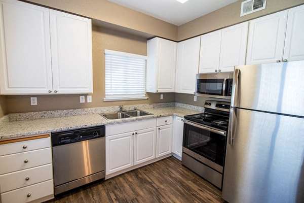 Kitchen with stainless-steel appliances at Sterling Pointe Apartments in Davis, California