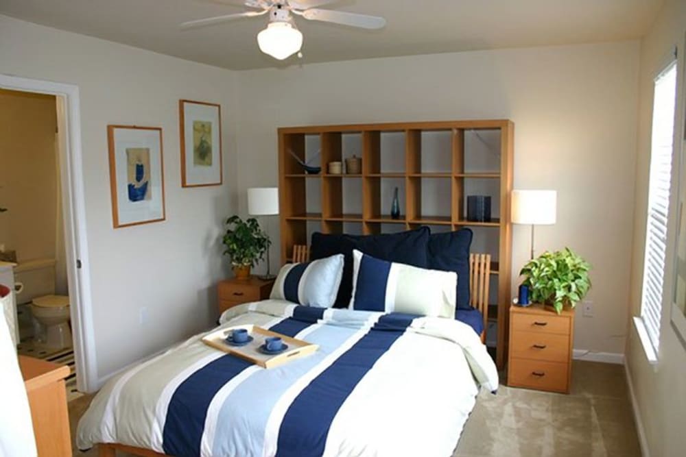 A well-lit main bedroom at The Village at NTC in San Diego, California