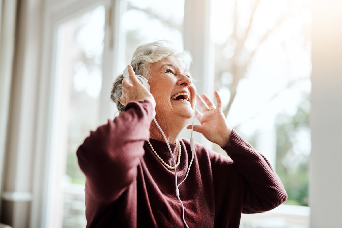 A resident listening to music on headphones at FountainBrook in Midwest City, Oklahoma