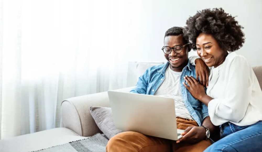 Couple using laptop at The Falgrove Apartments in Omaha, Nebraska