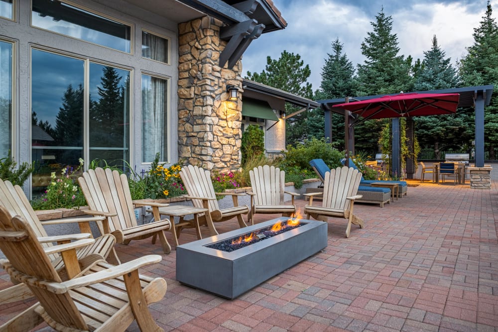 Outdoor lounge area with firepit at Montrachet Apartment Homes in Lakewood, Colorado