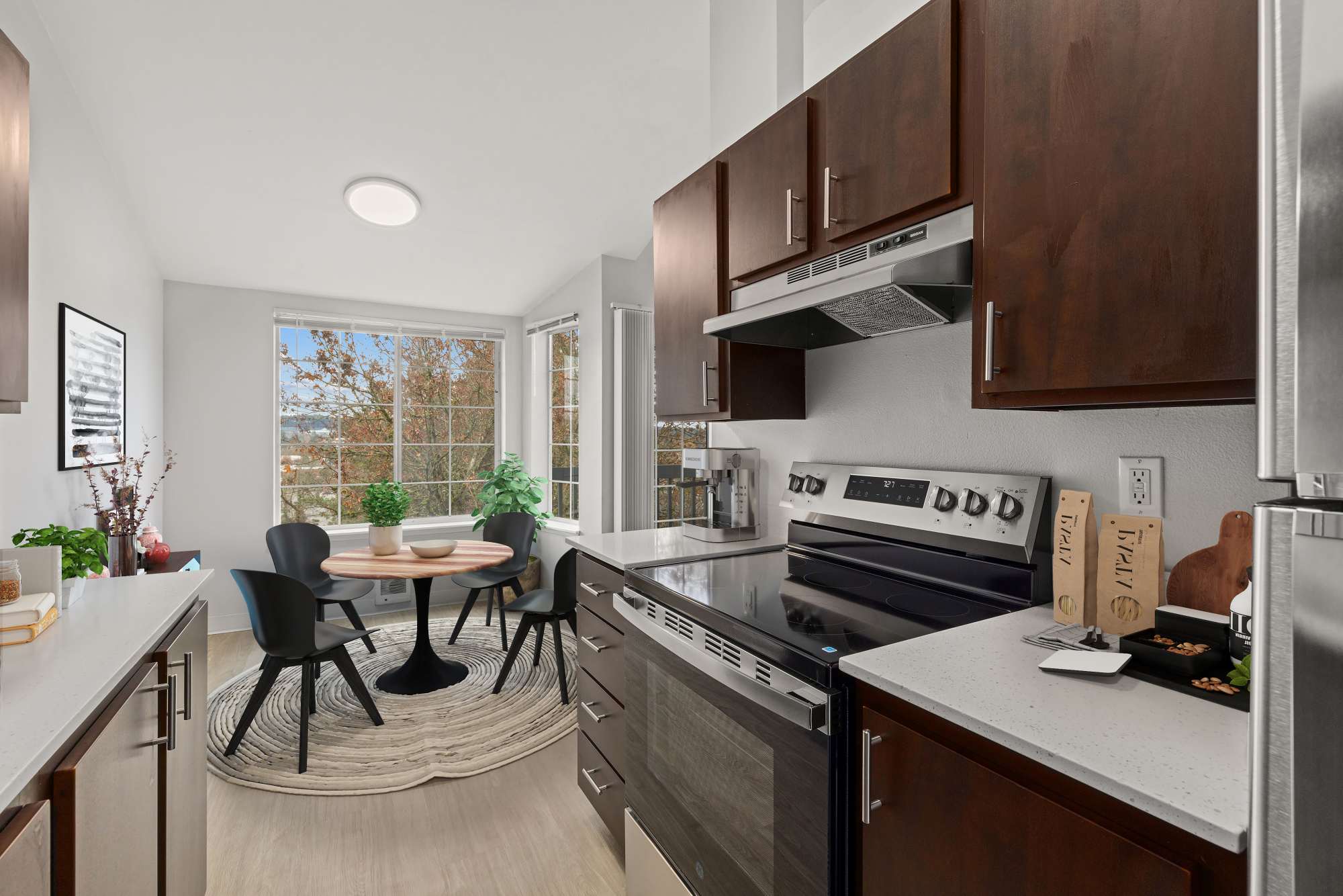 Kitchen and dining area at Wellington Apartments in Silverdale, Washington