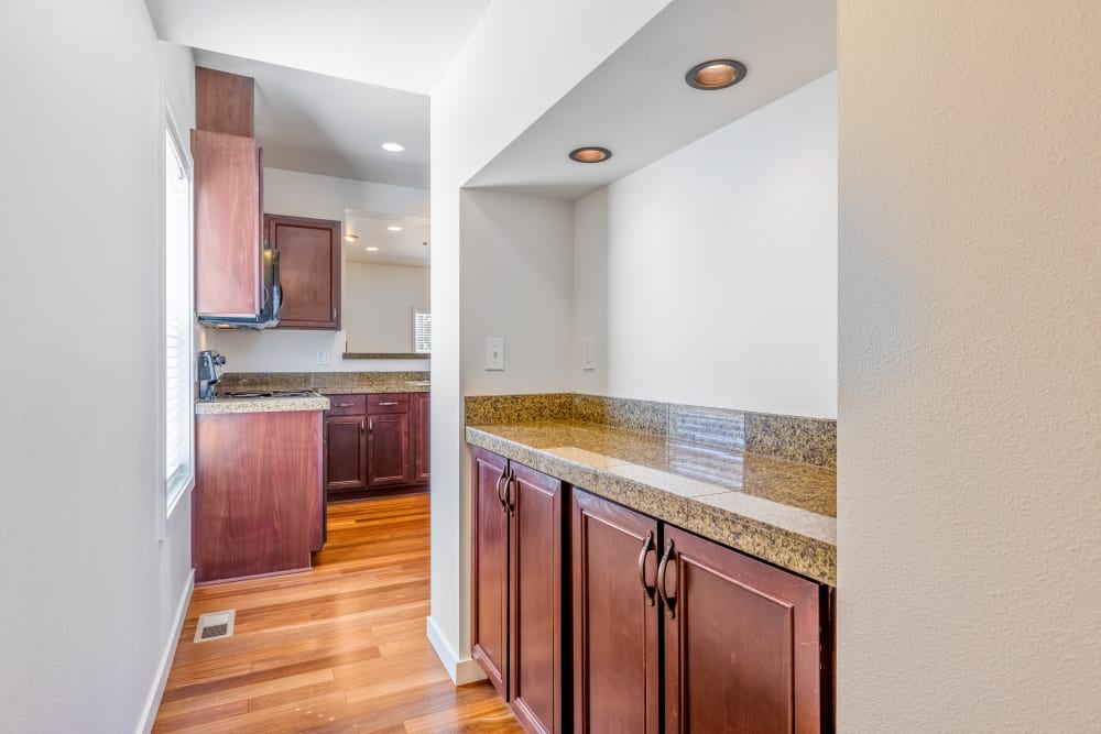 An apartment kitchen leading to a wine bar at Meriwether Landing in Joint Base Lewis McChord, Washington