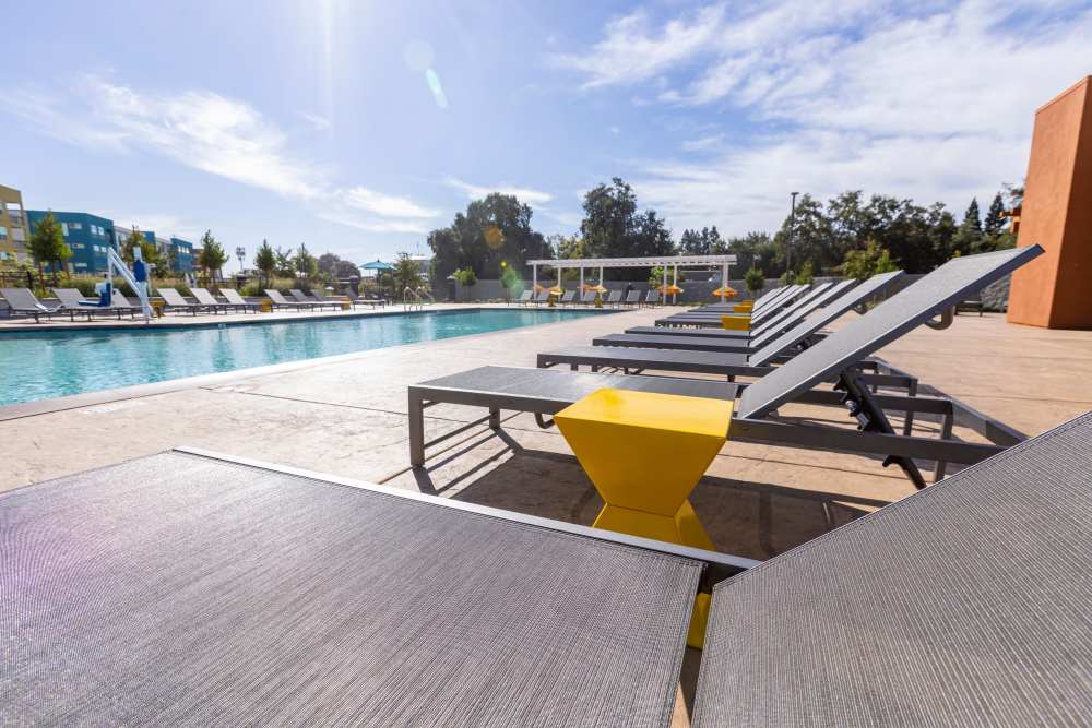 Outdoor seating near the pool at Solasta in Sacramento, California 