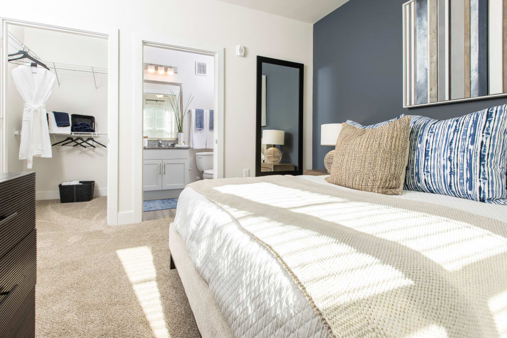 Brightly lit bedroom suite at South City Apartments in Summerville, South Carolina