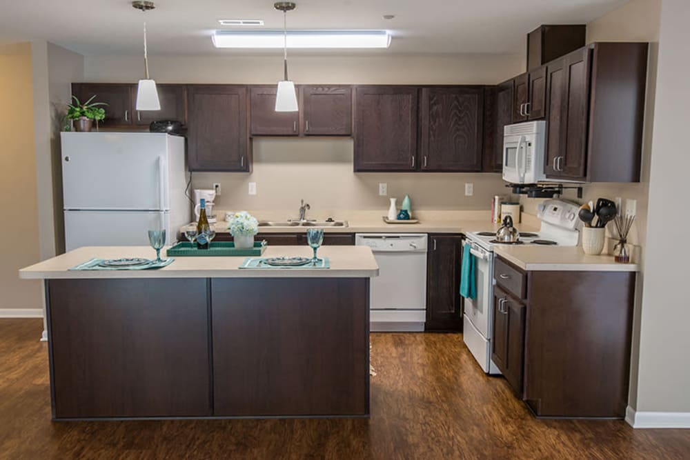 Spacious layout with wood-style flooring at Silver Lake Hills in Fenton, Michigan