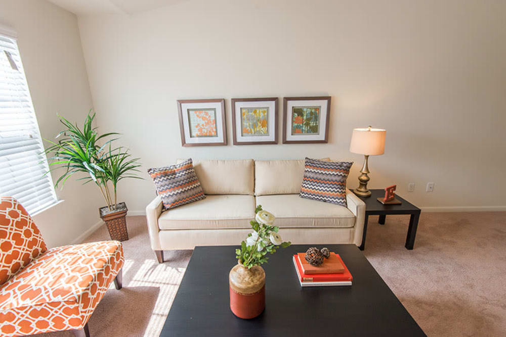 A beautifully decorated living room in the model home at Silver Lake Hills in Fenton, Michigan