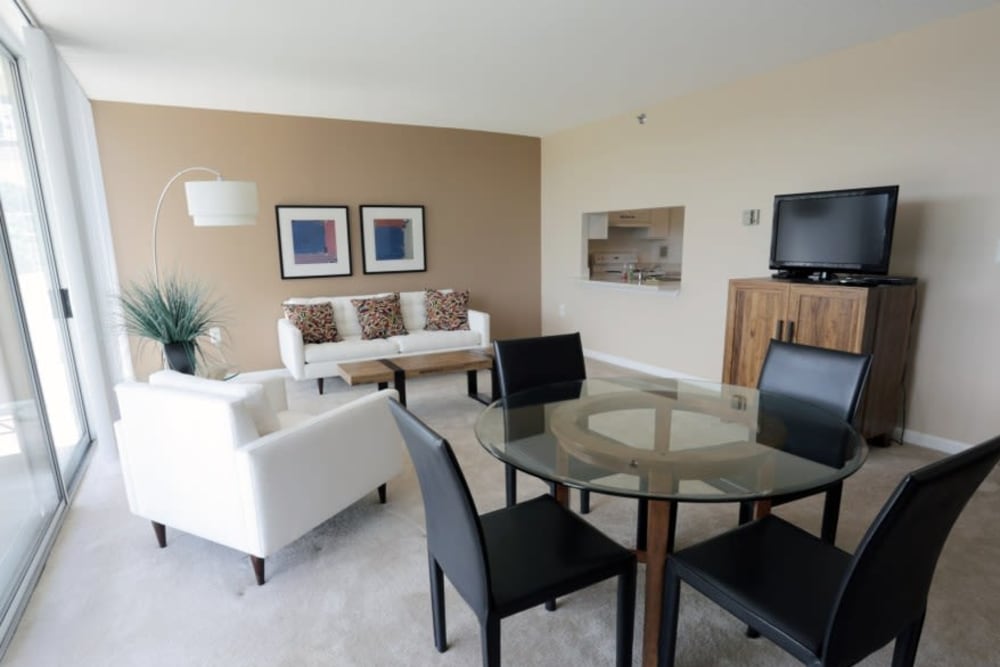 A spacious living room with a view at Westwood Tower Apartments in Bethesda, Maryland
