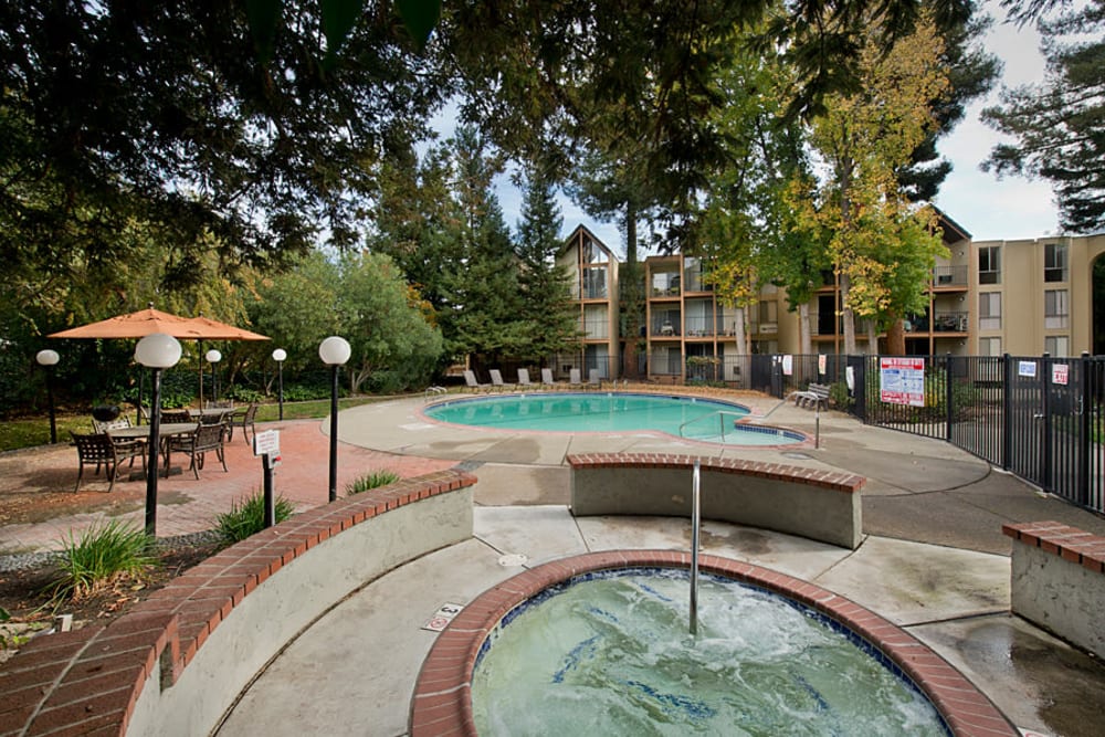 Poolside patio with table and chairs at Atrium Downtown in Walnut Creek, California