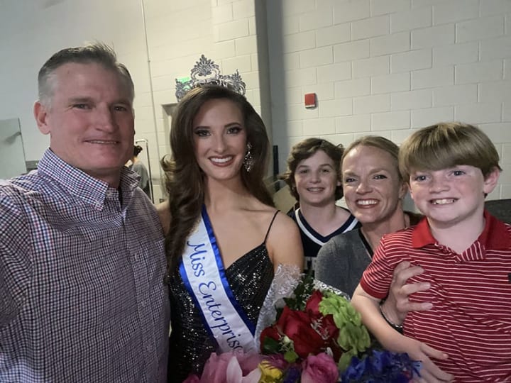 Les Hogan with daughter Emma crowned as Miss Enterprise and her mom and two brothers