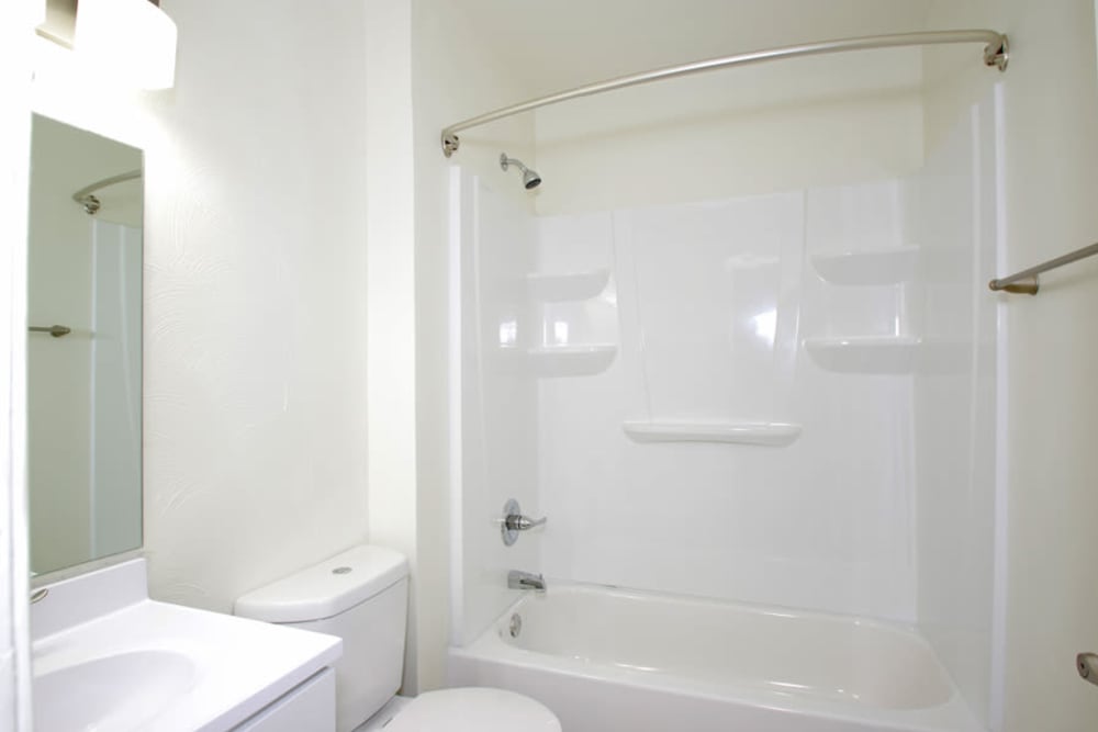 Bathroom with bathtub and shower at Old Mill Townhomes in Lynchburg, Virginia