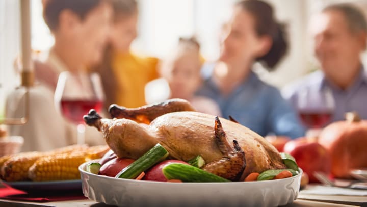 Multigenerational Thanksgiving with Turkey Being Served