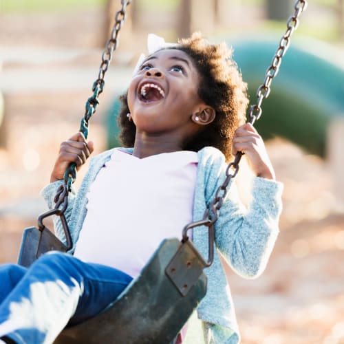 A girl swing in a park near Miramar Milcon in San Diego, California