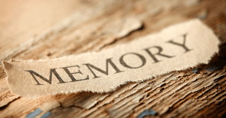 the word memory written on a piece of paper