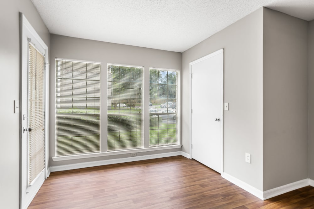 Plush carpeting in an apartment living room with a fireplace at Gates at Jubilee in Daphne, Alabama