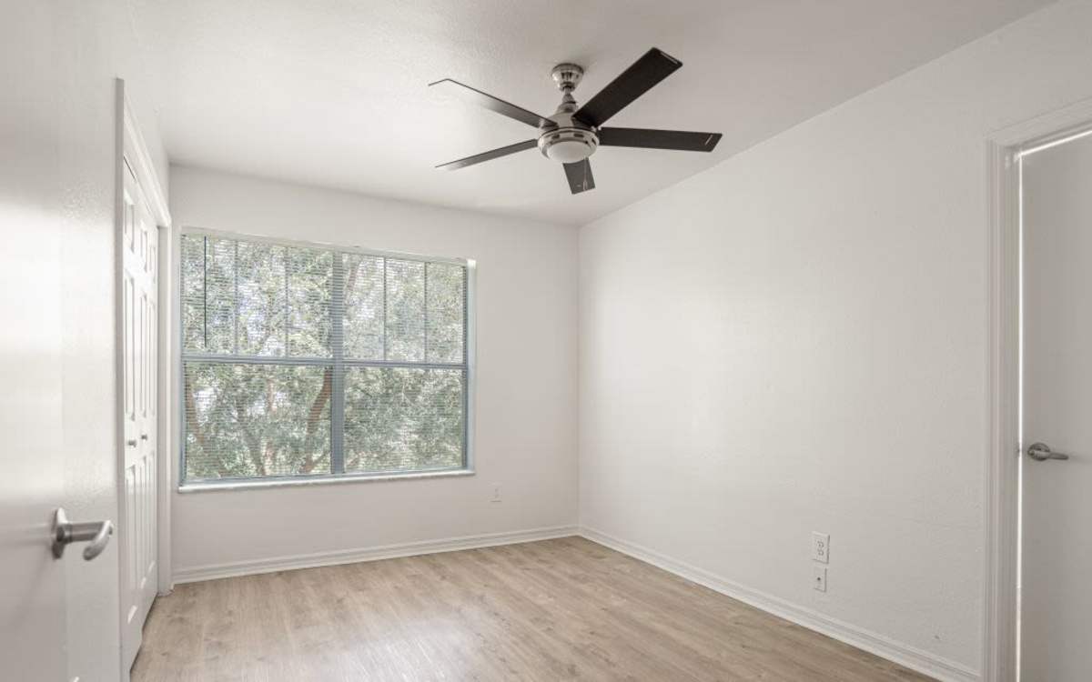 Living room with a ceiling fan at Cypress Commons in Wildwood, Florida