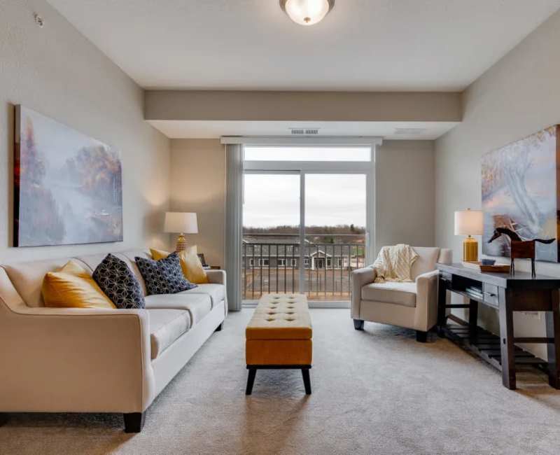 senior apartment living room with big windows and modern furniture