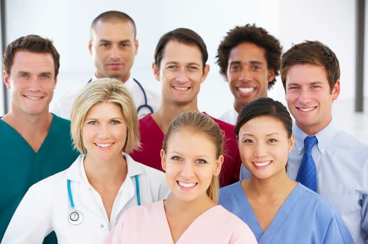 Health care professionals taking a group photo. 