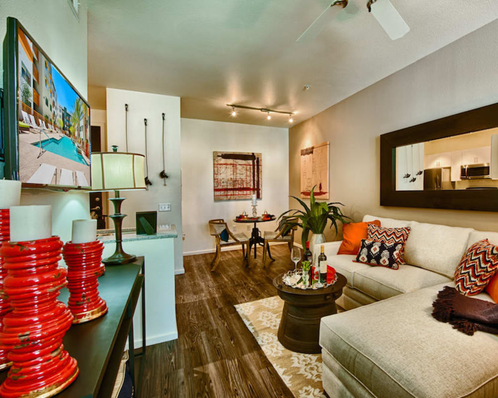 Well-furnished living space in a model home at Cactus Forty-2 in Phoenix, Arizona