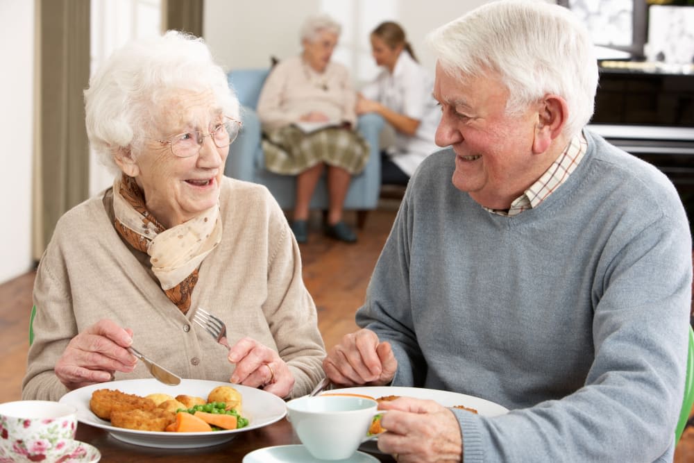 Two residents eating a meal together at Harmony at Waldorf in Waldorf, Maryland
