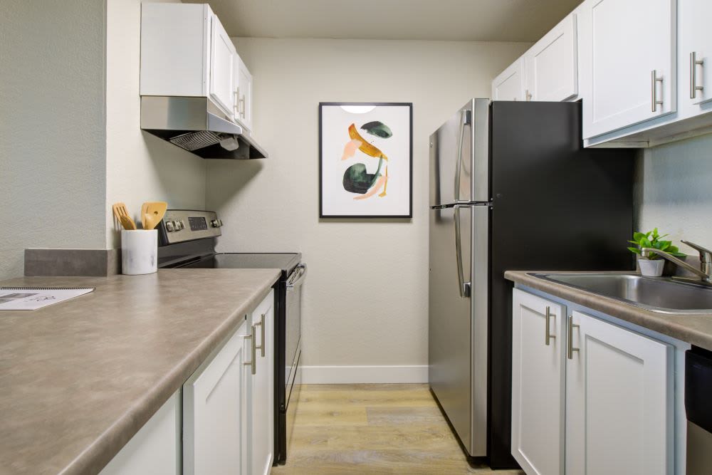 Open floor plan living and dining space areas at Terra Apartment Homes in Federal Way, Washington