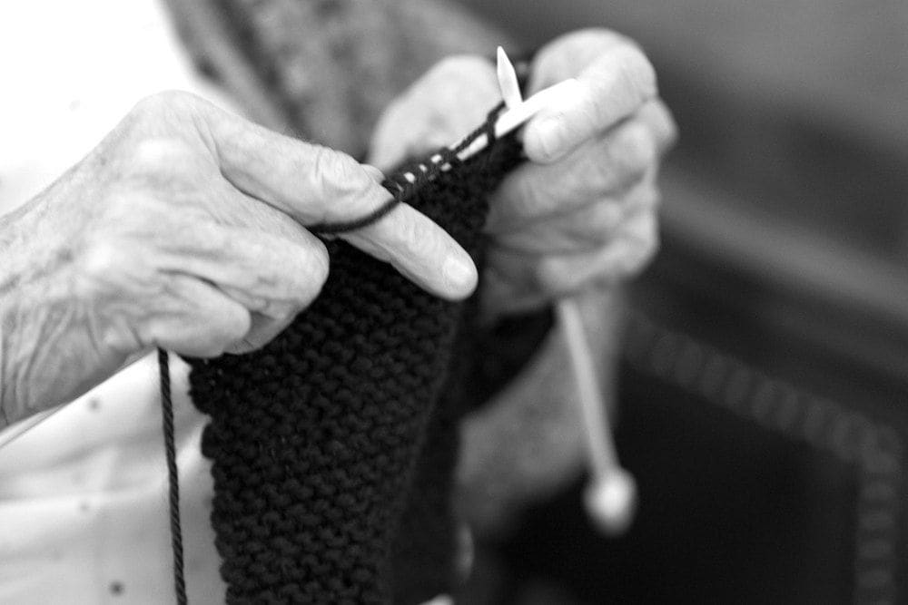 A resident knitting at Gables of Ojai in Ojai, California