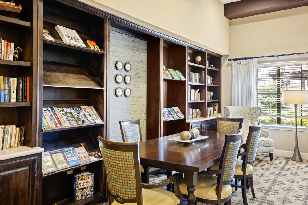 Sitting area with library bookshelves at Anthology of Stonebridge Ranch in McKinney, Texas