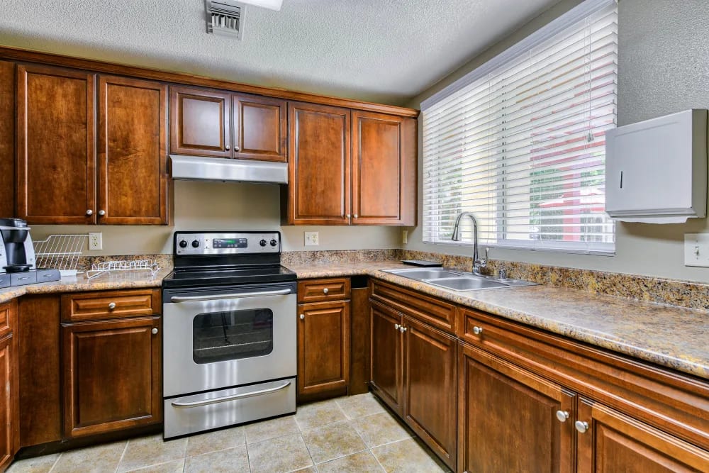 Apartment kitchen at Windsor Court & Stratford Place in Westminster, California