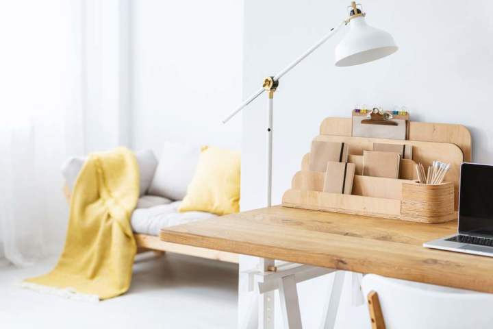 Desktop organizer for small office storage on top of a wood desk