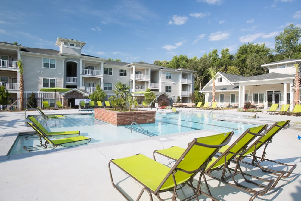 Pool area with a center fountain at Ansley Commons Apartment Homes in Ladson, South Carolina