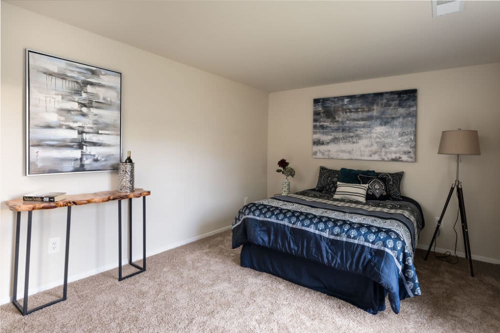Large master bedroom with plush carpeting at The Glendale Residence in Lanham, Maryland