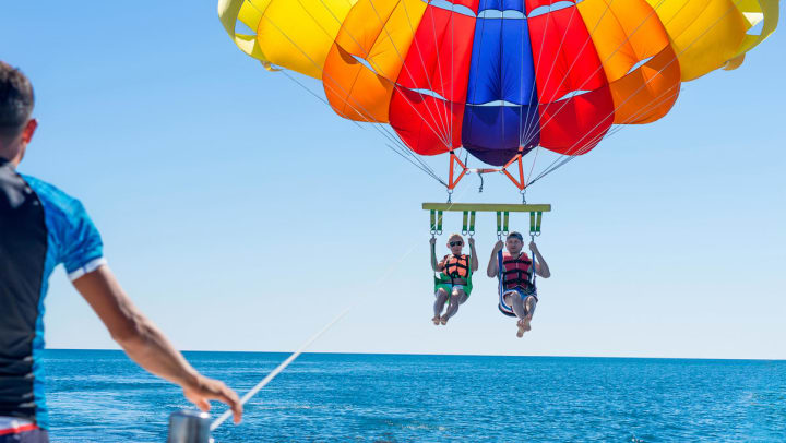 Two people parasailing in Destin
