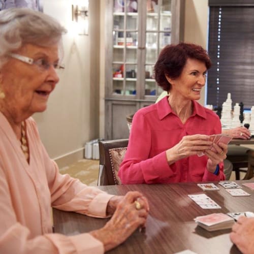 Residents enjoying a card game at The Crossings at Eastchase in $Montgomery, Alabama