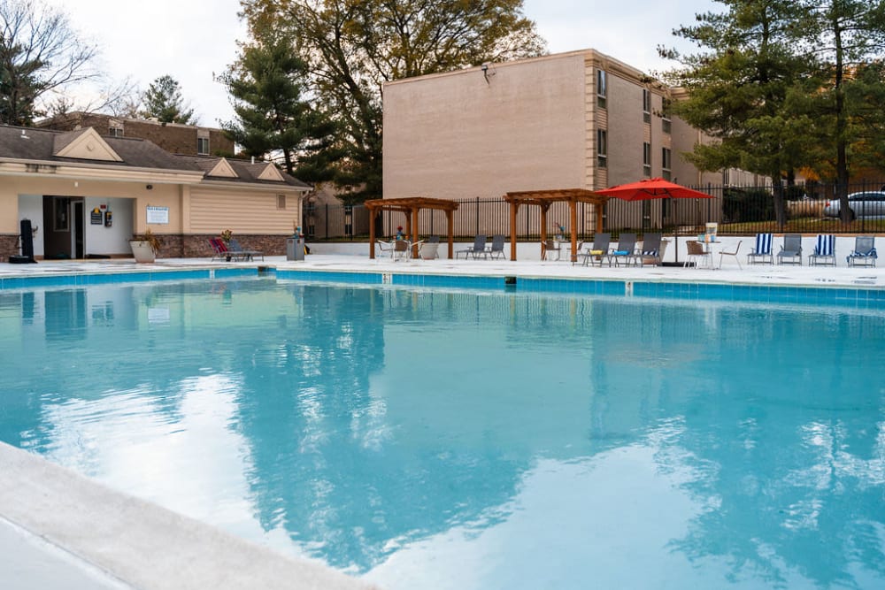 Large swimming pool with a sundeck at The Glendale Residence in Lanham, Maryland