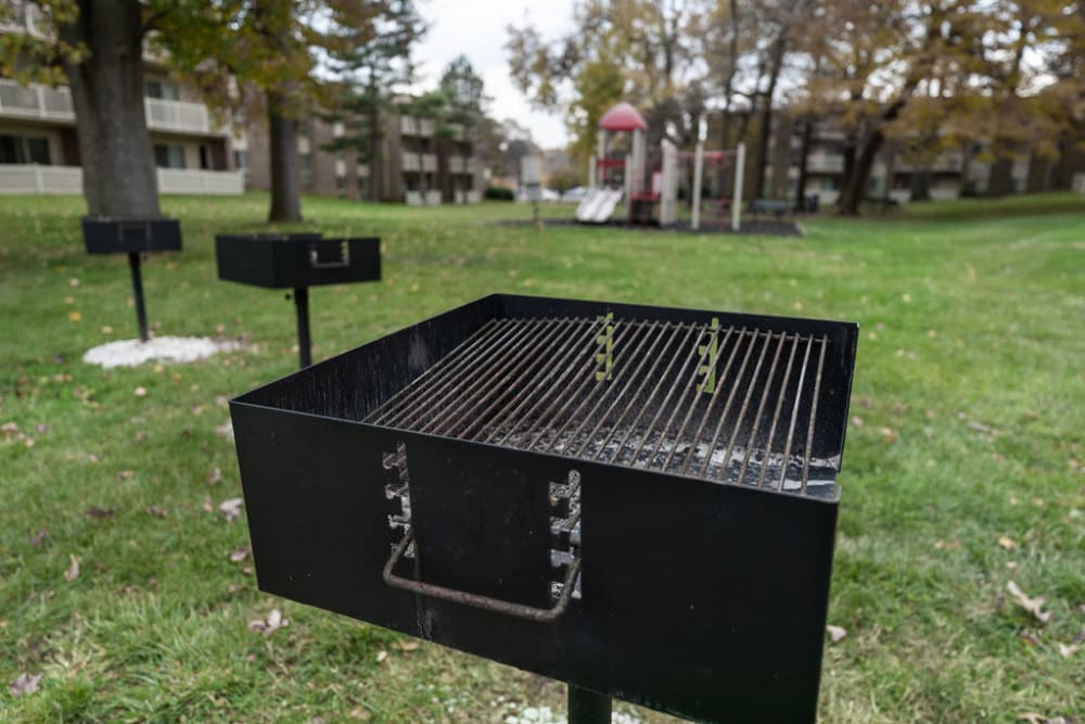 Charcoal grill surrounded by grass for a picnic at The Glendale Residence in Lanham, Maryland