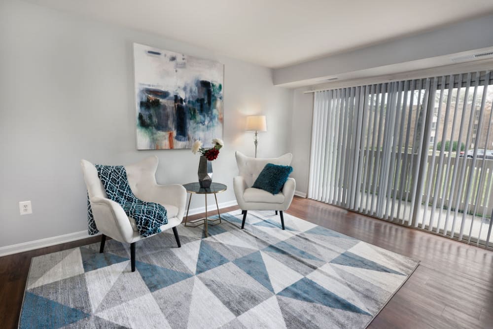 Spacious living room with wood-style flooring at The Glendale Residence in Lanham, Maryland