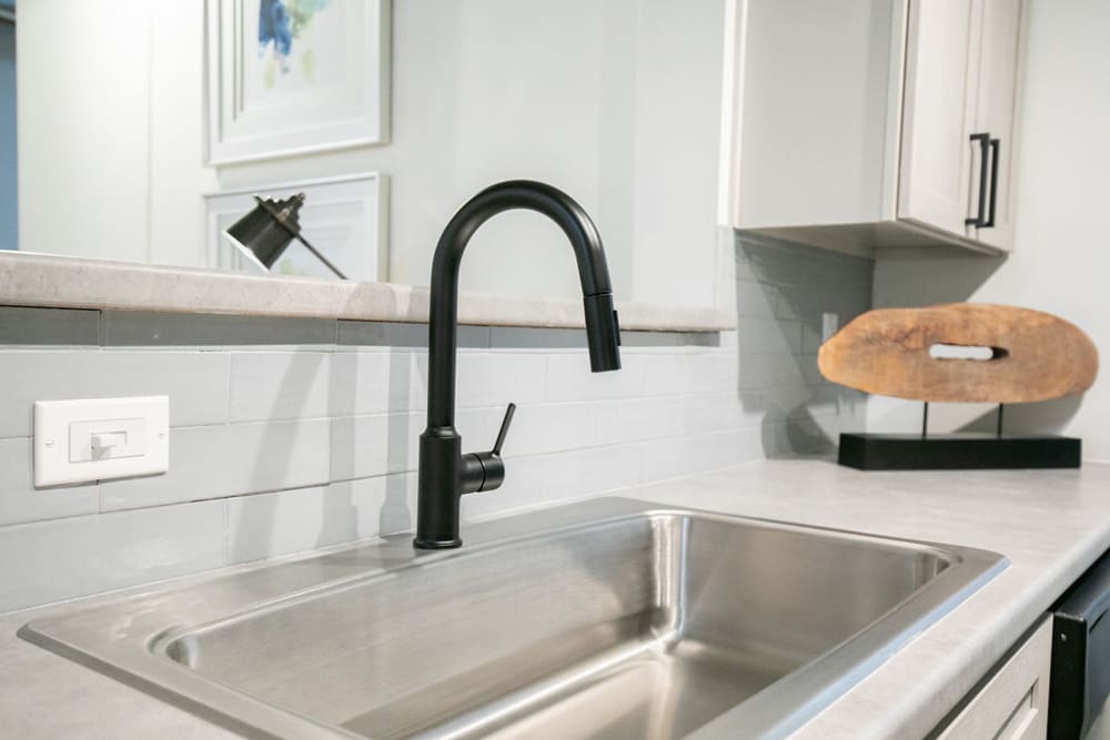 Updated kitchen sink at Lofts at Riverwalk in Columbus, Georgia