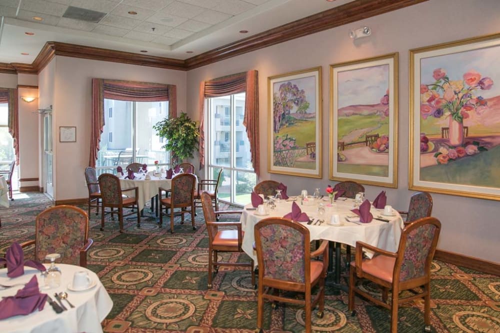 Elegant dining seating with paintings at Las Fuentes Resort Village in Prescott, Arizona
