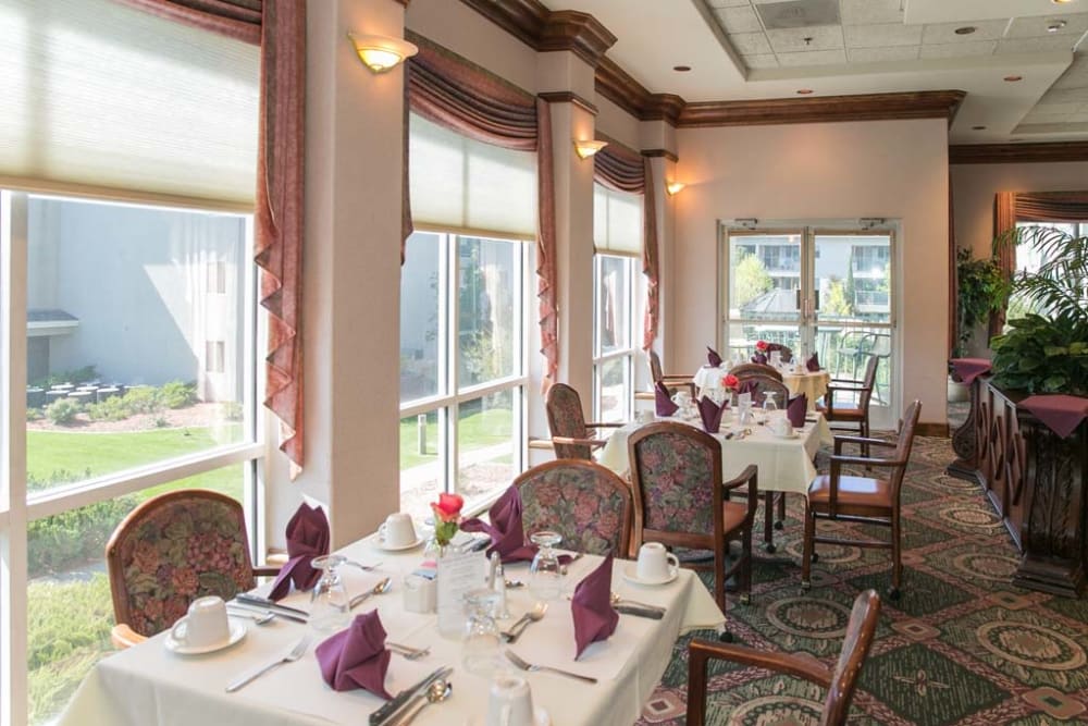 Elegant dining area with large windows at Las Fuentes Resort Village in Prescott, Arizona