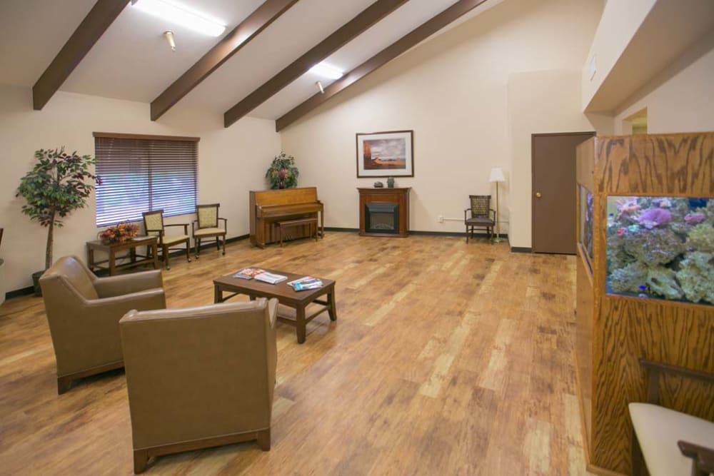 Cheerful sitting area with high beam walls at Sherwood Village Assisted Living & Memory Care in Tucson, Arizona