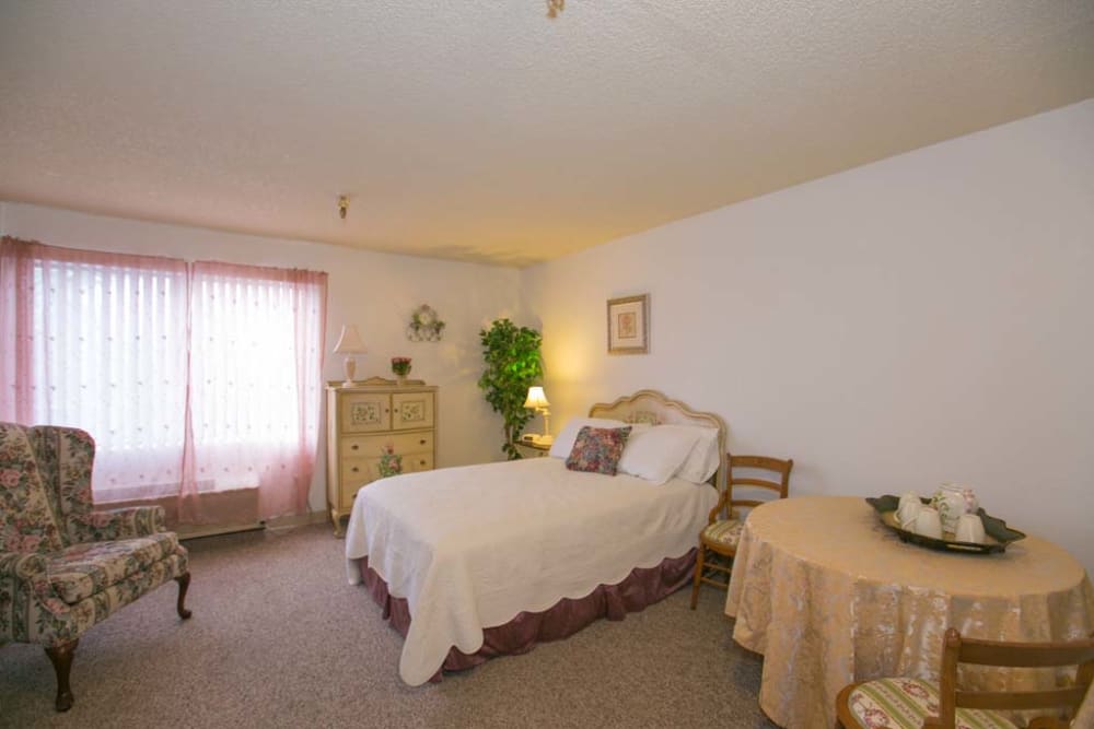 Serene bedroom in apartment at Sherwood Village Assisted Living & Memory Care in Tucson, Arizona