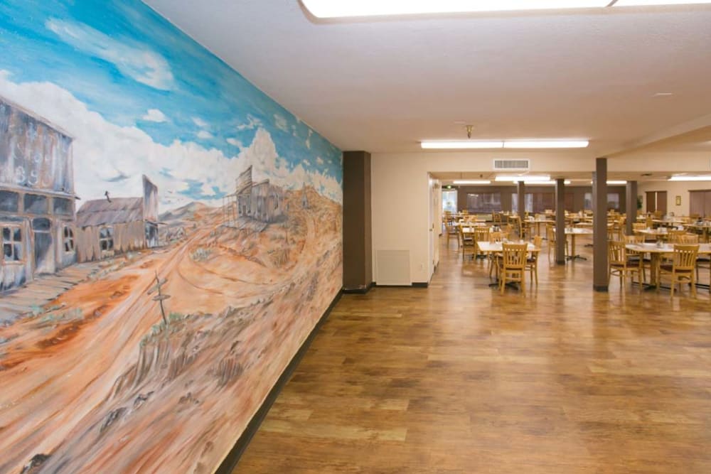 Mural painting on dining room wall at Sherwood Village Assisted Living & Memory Care in Tucson, Arizona