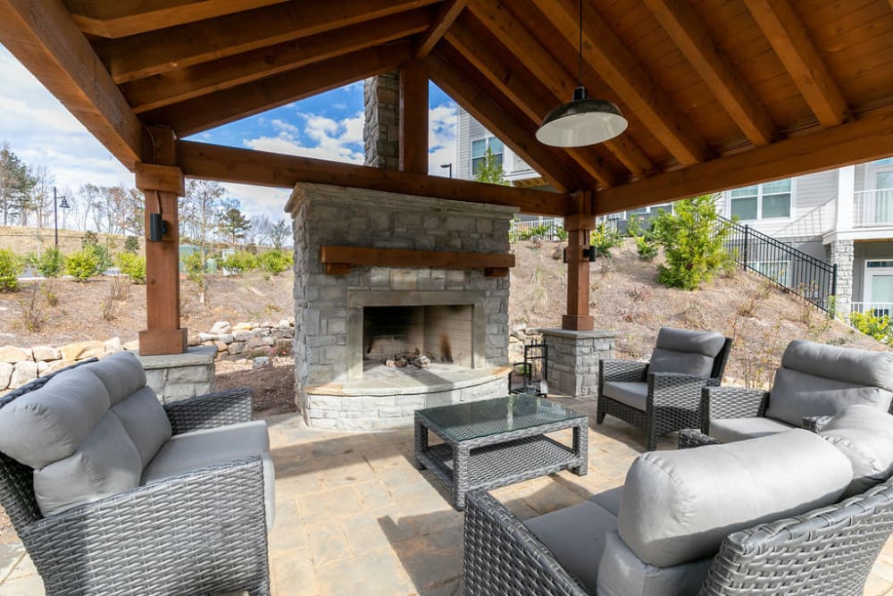 Outdoor fireplace lounge at Gibson Flowery Branch | Apartments in Flowery Branch, Georgia